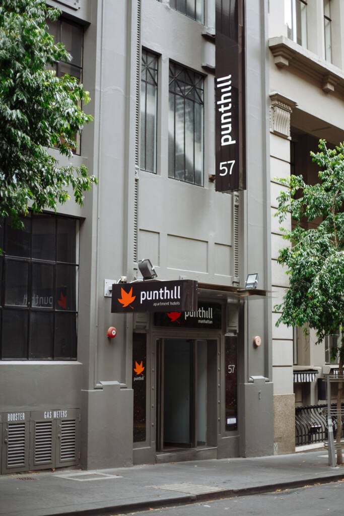 Street trees frame the Punthill Manhattan door on the quiet laneway