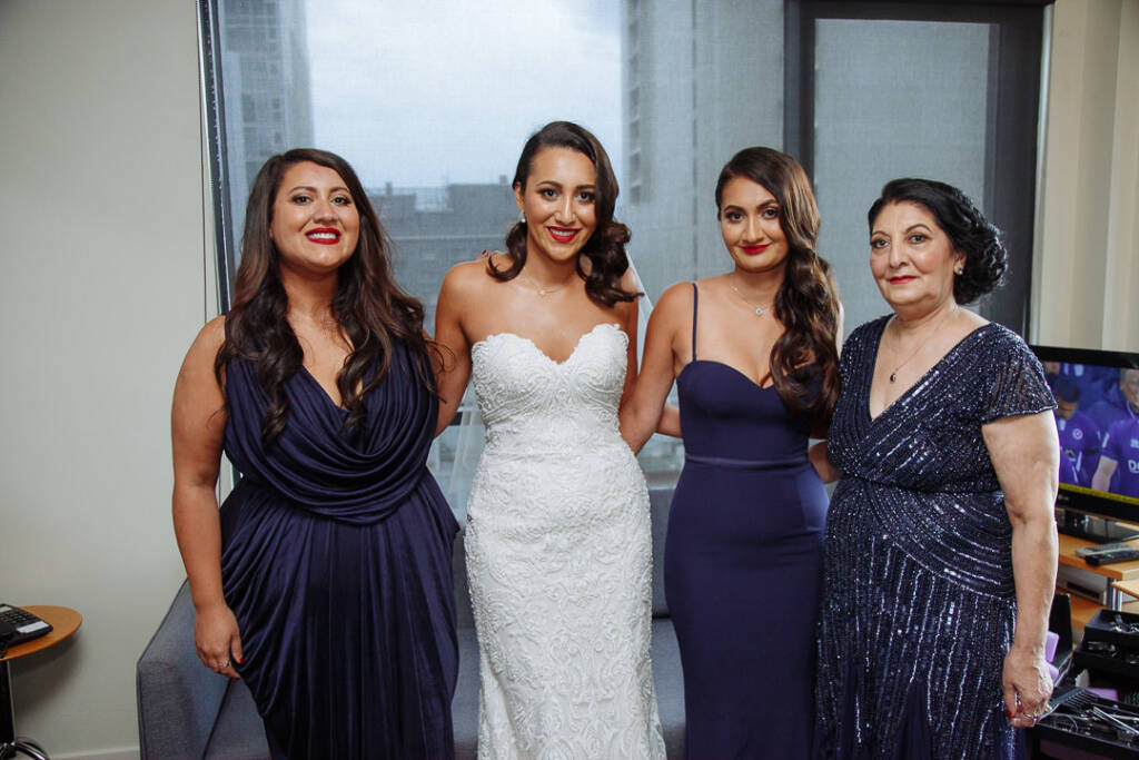 Navy gowns line up around the lace for the window portrait
