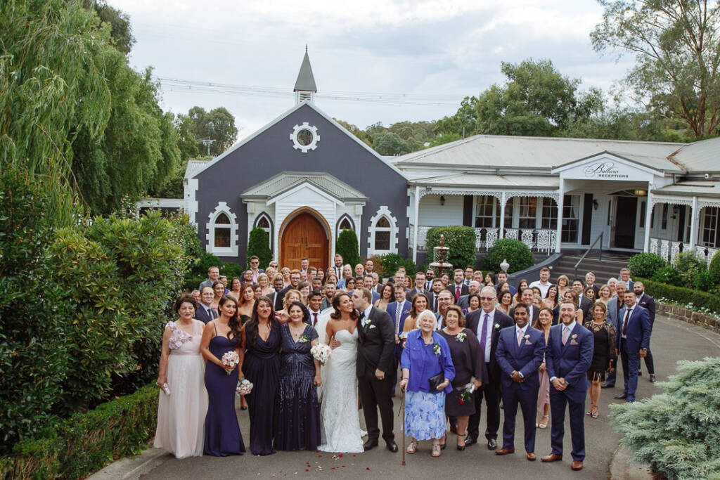 Every guest gathers before the slate chapel for the big photo