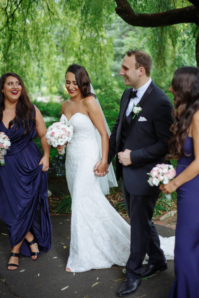 Laughter carries the party down the willow-shaded path