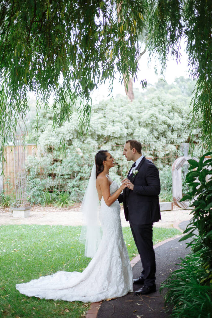 Face to face on the garden path beneath the willow curtain
