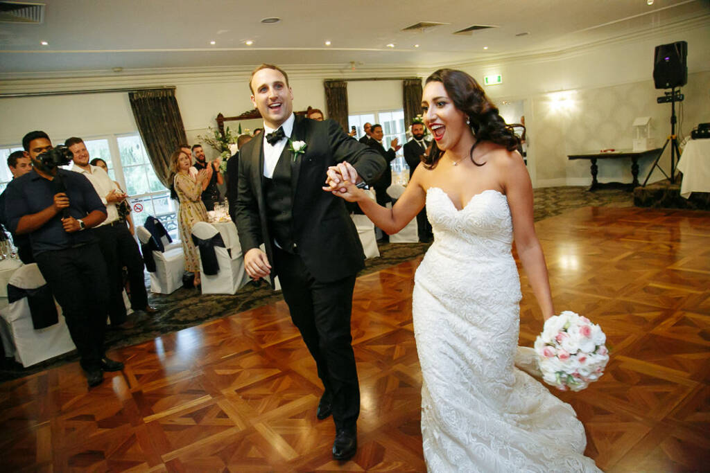 Hand in hand they bound onto the parquet to whoops and camera flashes