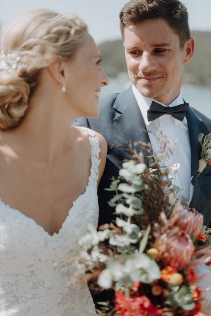 Sean looks towards Emma during a close wedding portrait.