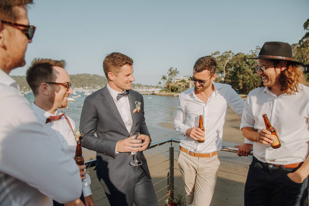 Sean chats with wedding attendants over drinks on BYRA’s waterfront deck.
