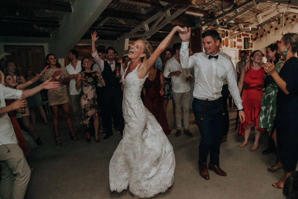 Sean raises Emma’s hand as she dances among cheering guests at BYRA.