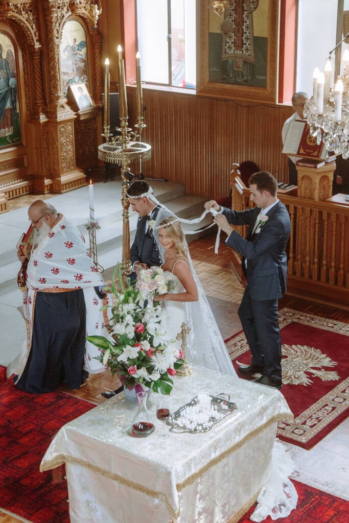Becky and George follow the priest during the Dance of Isaiah at St Nicholas Greek Orthodox Church.