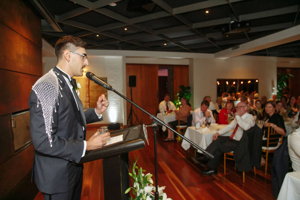 George delivers a wedding speech from the lectern inside The Boat House in Canberra.