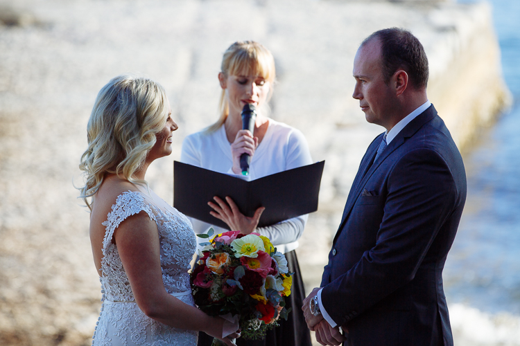 The celebrant reads from her folder between Sabine and Arthur at Bradleys Head Amphitheatre