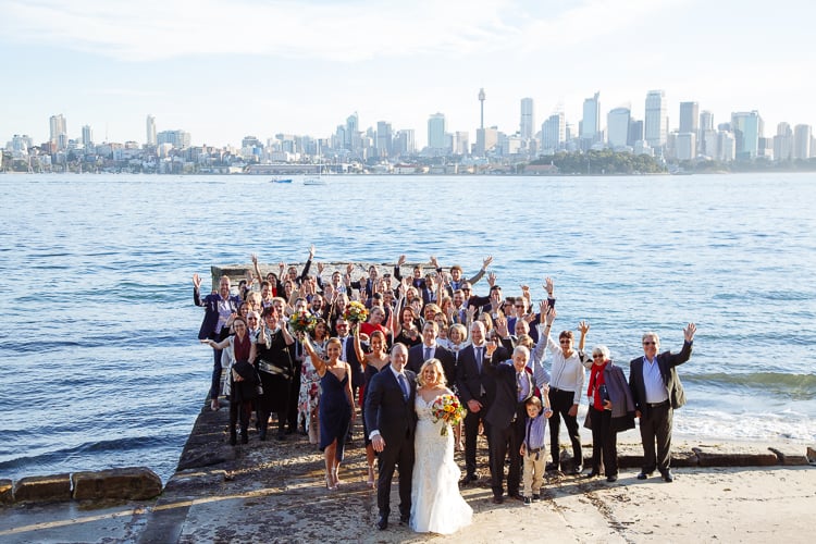 Sabine, Arthur and their guests wave from the Bradleys Head jetty on Sydney's North Shore