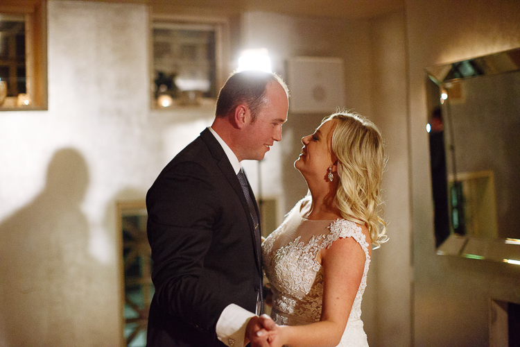 Sabine and Arthur hold hands on the dance floor at Bathers'
