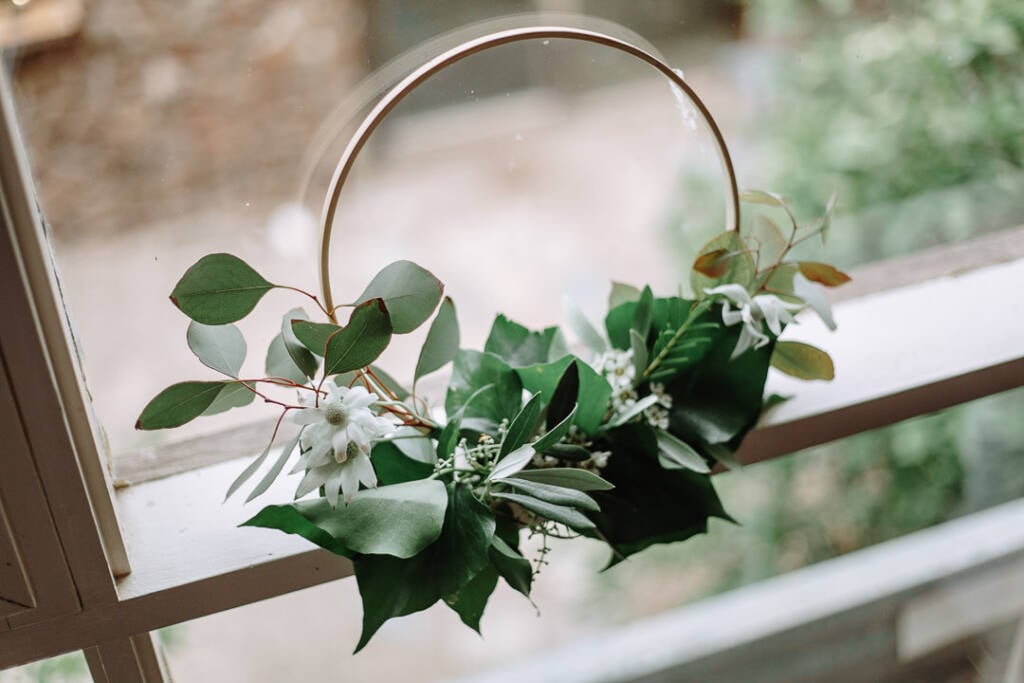 A foliage hoop rests against the window at Sunnystones.
