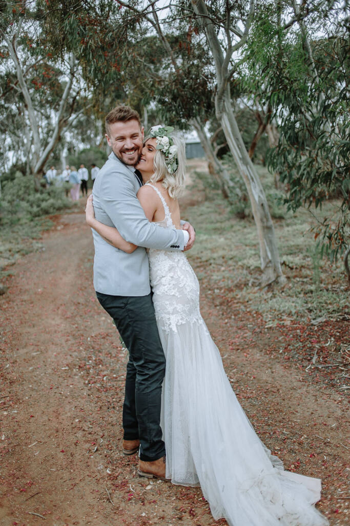 Kelly hugs Tory closely on a bush track at Camp Sunnystones.