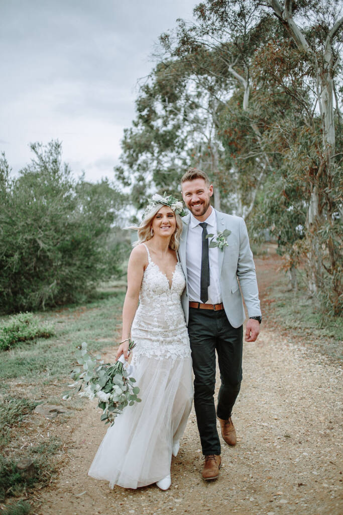Kelly and Tory walk towards the camera through the bush at Sunnystones.