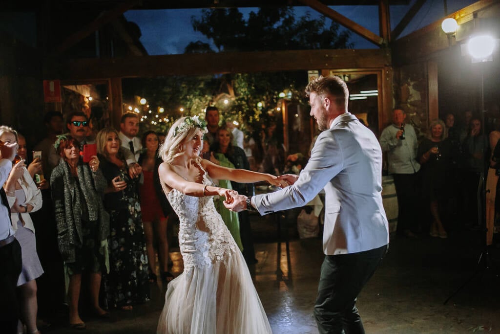 Kelly and Tory join hands to dance at their Camp Sunnystones reception.