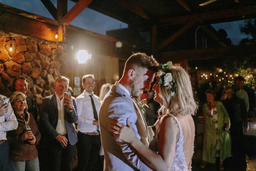 Kelly and Tory lean close together during their wedding dance.