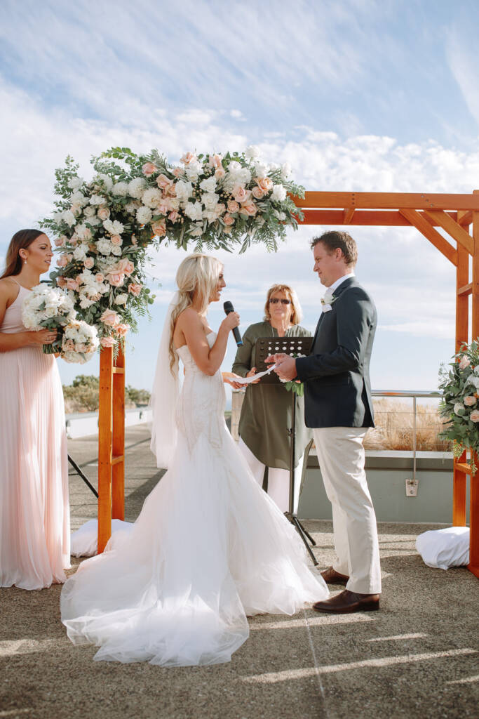 Aasher reads her vows at The National's ocean-view ceremony arbour in Cape Schanck.