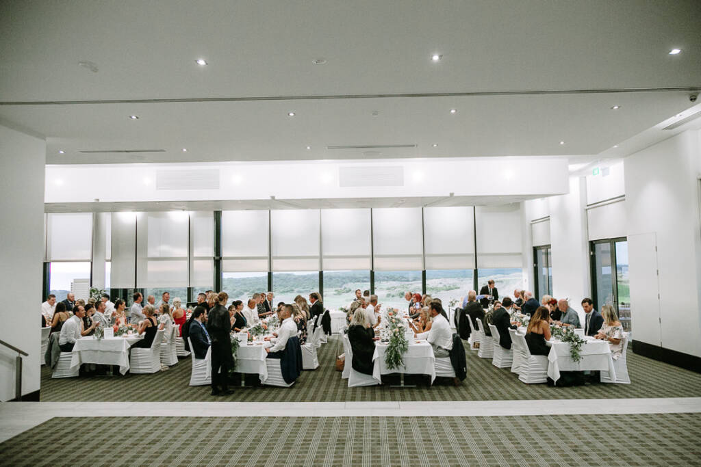 Guests at long tables inside The National Golf Club's Cape Schanck clubhouse, Mornington Peninsula.