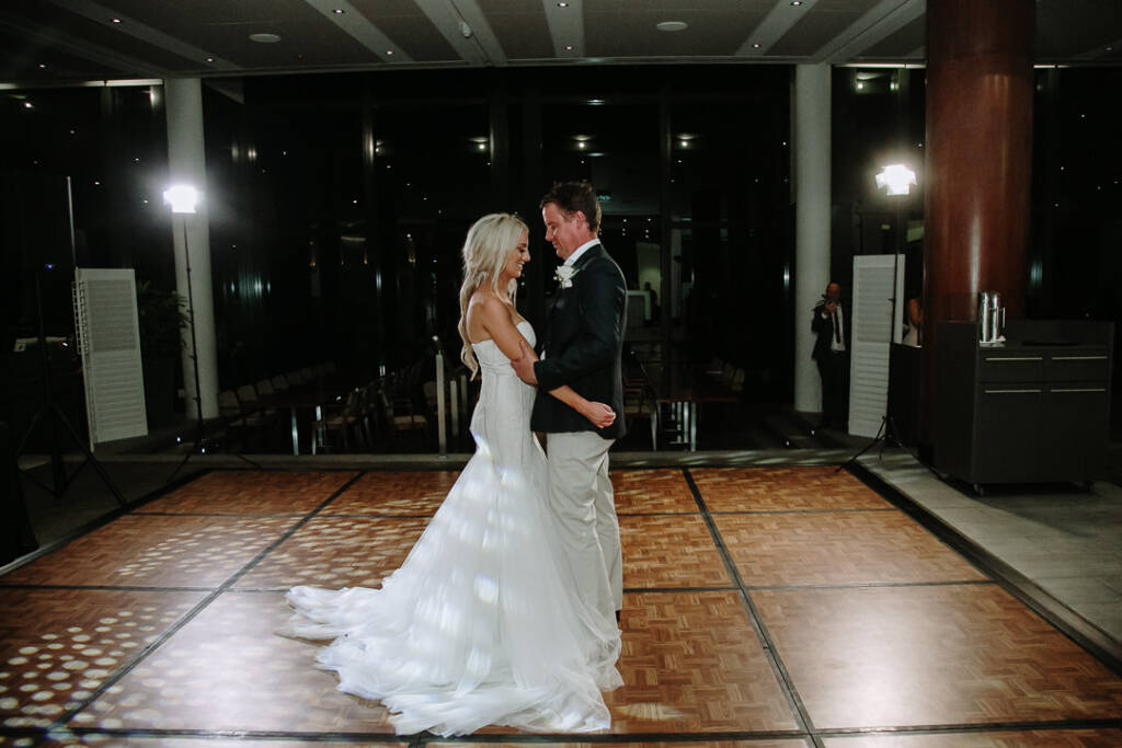 Aasher and Nick share their first dance on the parquet floor at The National Golf Club.