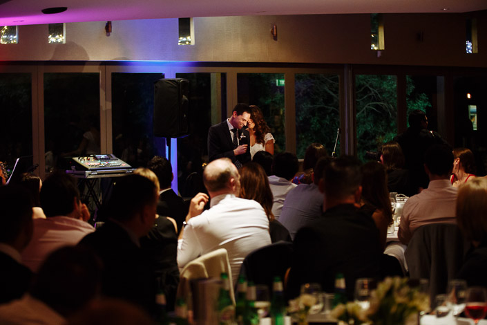 Pasquale holds a microphone beside Pascale at The Boulevard in Kew, with guests seated before them.