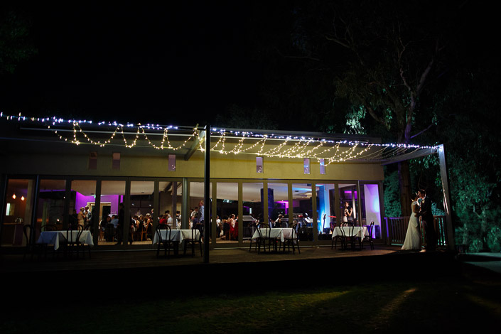 Night photo of Pascale and Pasquale beside the fairy-lit terrace at Boulevard in Kew.
