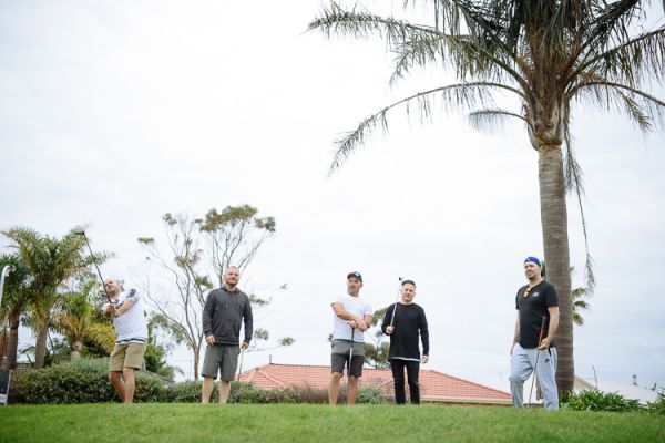 Groomsmen watching a tee shot on the fairway, Mornington Peninsula
