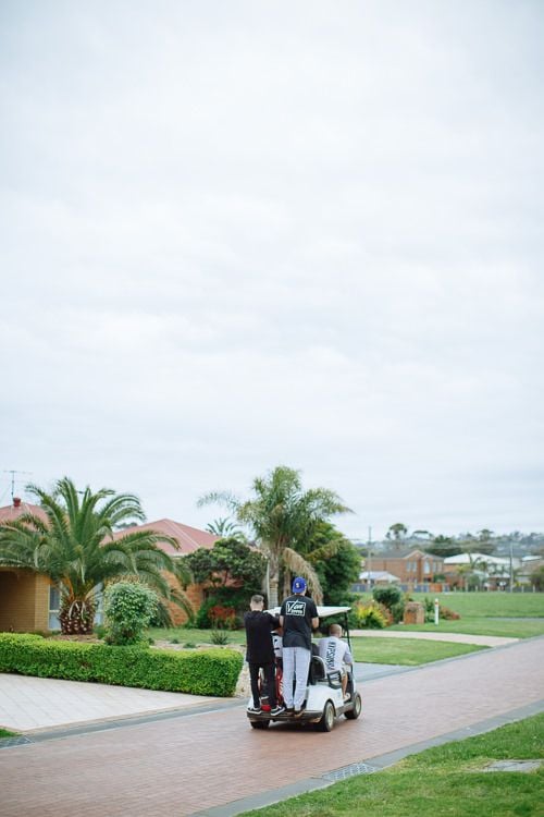Golf carts heading home under the palms before wedding preparations