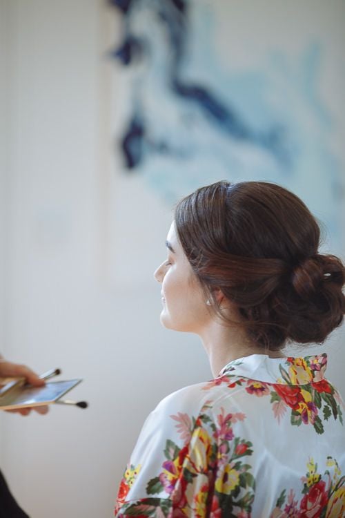 The bride's low chignon wedding hairstyle from behind