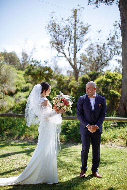 Bride and groom face to face at the first look