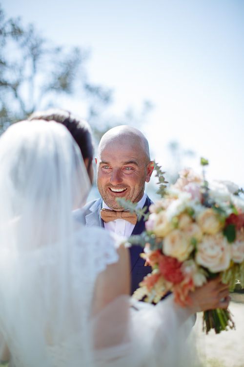 The groom's delighted reaction seeing his bride for the first time