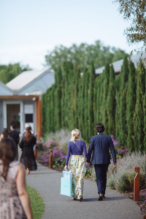 Guests arriving through the gardens at Stillwater at Crittenden