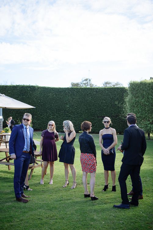 Guests mingling on the lawn before the ceremony at Stillwater at Crittenden