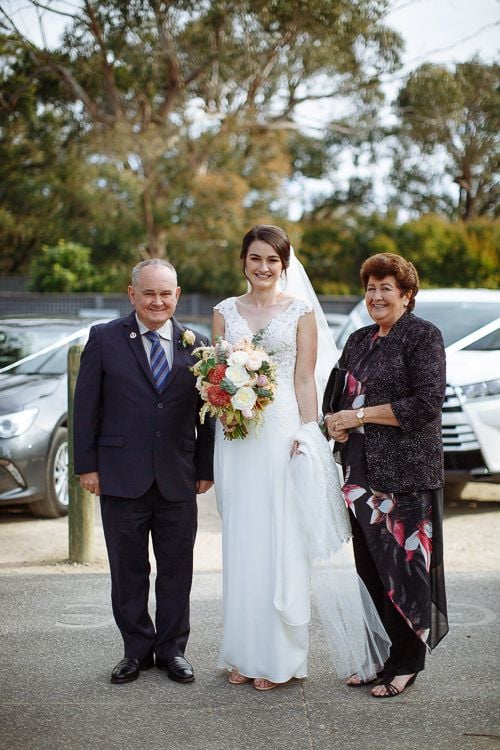 Bride with her parents before walking down the aisle