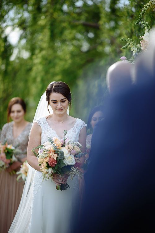 Wedding ceremony beneath the willows beside the Crittenden Estate lake