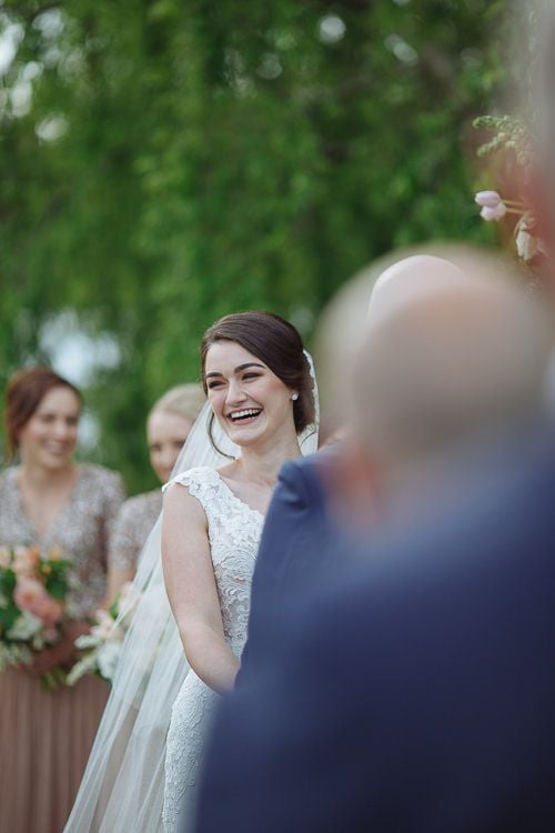 Caitlin and Brad during their lakeside wedding ceremony