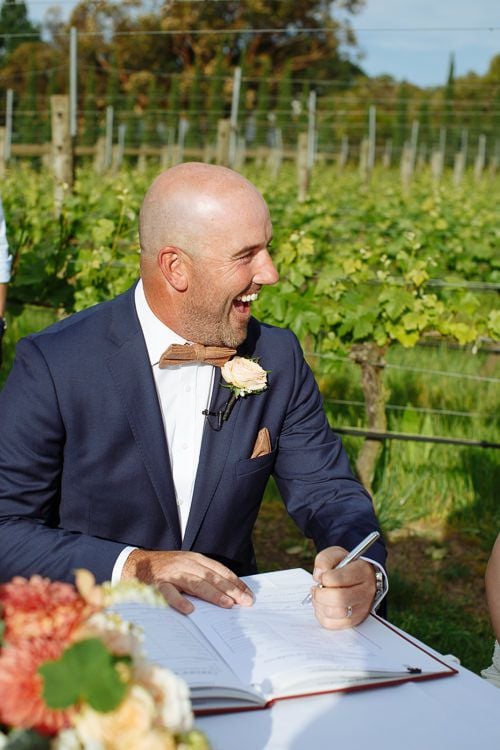 Caitlin and Brad during their lakeside wedding ceremony
