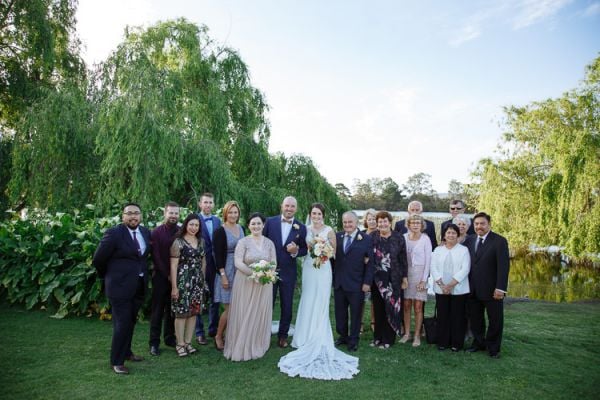 Newlyweds celebrating with guests on the Crittenden Estate lawn