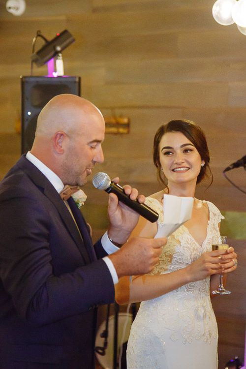 Guests laughing during the wedding speeches