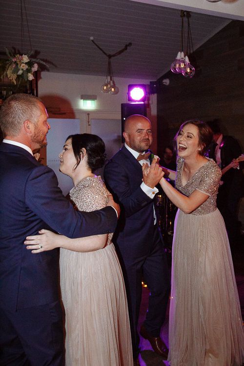 Bridal party joining the couple on the dancefloor