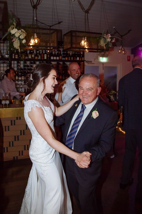 Bride dancing with her grandfather at the reception