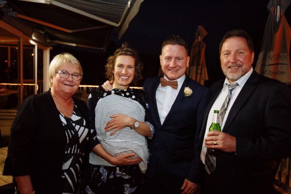 Wedding guests grouped for a photo at the reception