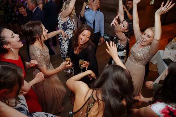 Caitlin and Brad celebrating on the dancefloor