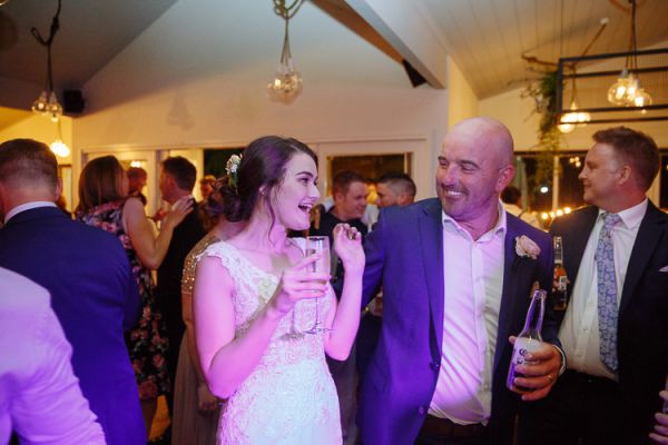 Caitlin and Brad celebrating on the dancefloor