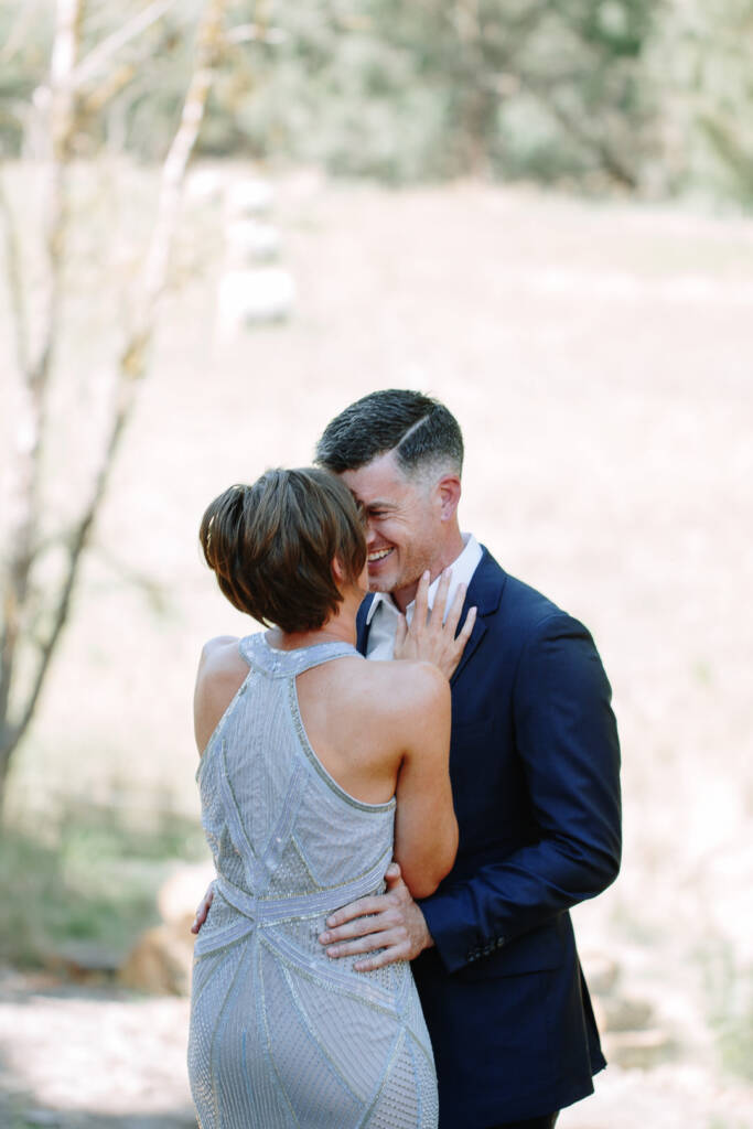 Camilla and Jason share a close embrace after their first look.