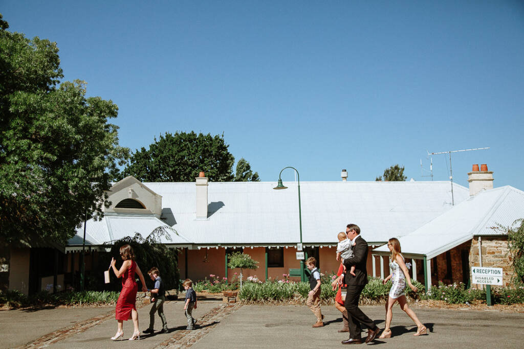 Guests walk past the Flowerdale Estate homestead towards the wedding.