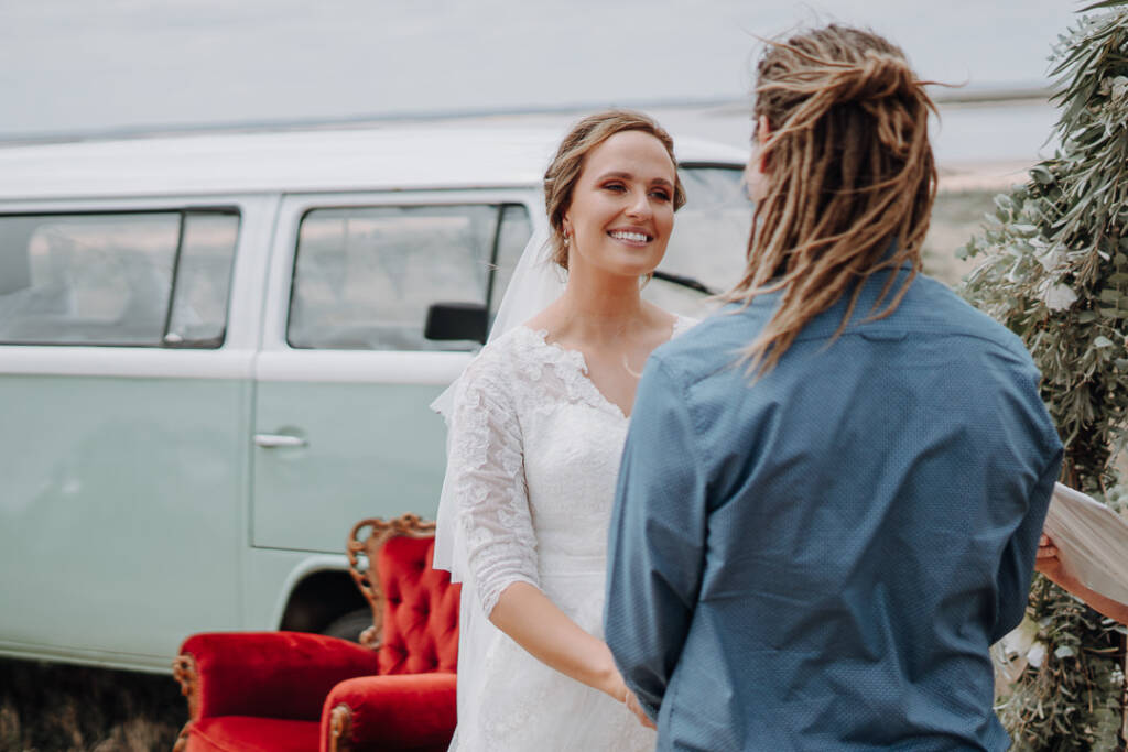 Bethany smiles at Dale beside the mint-and-white van at Lake Tyrrell.