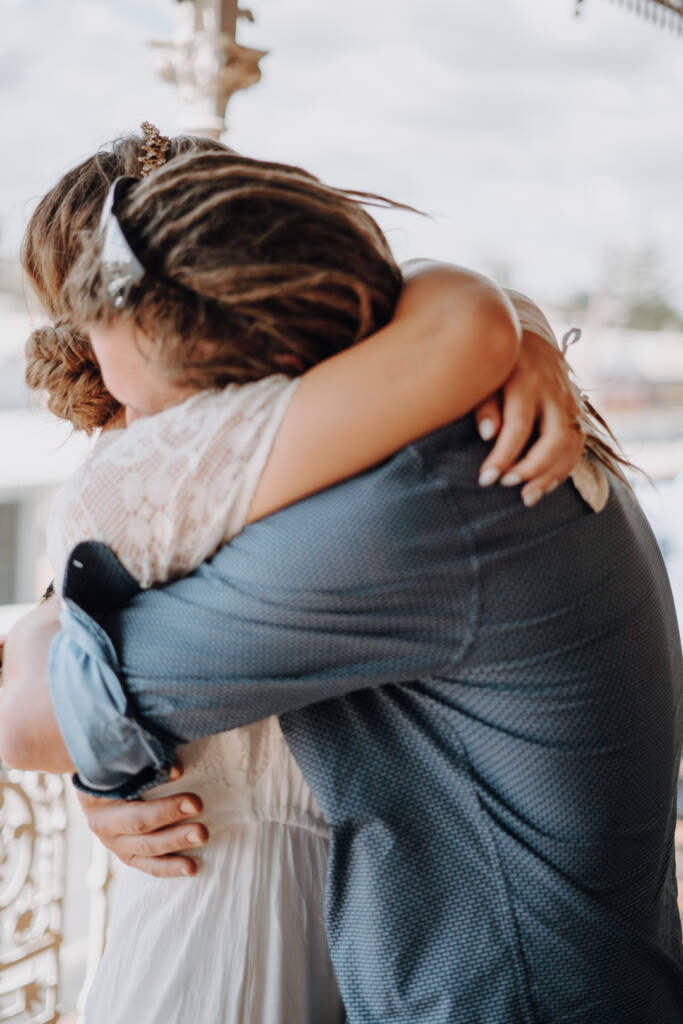 Bethany wraps her arms around Dale in a close embrace.