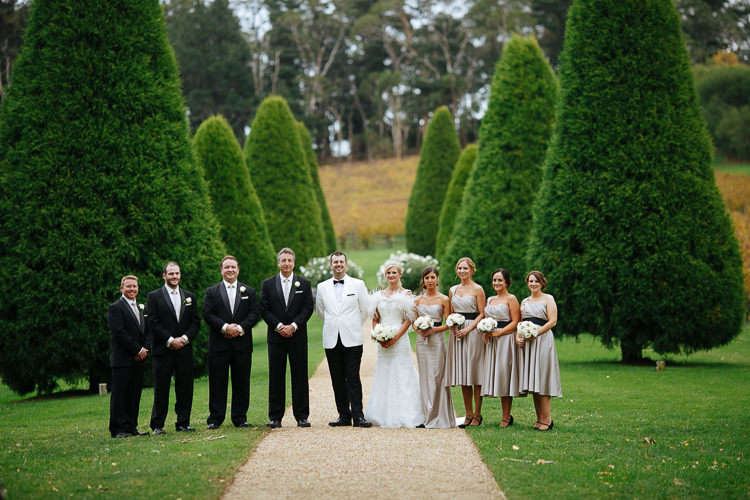 The wedding party lines the garden path at Lancemore Lindenderry Red Hill.