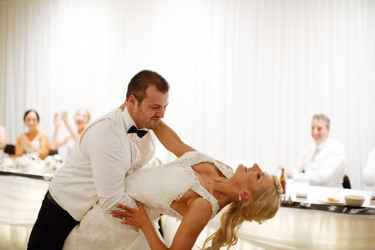 Alex dips Aggie on the dance floor at Lindenderry Red Hill as guests clap.