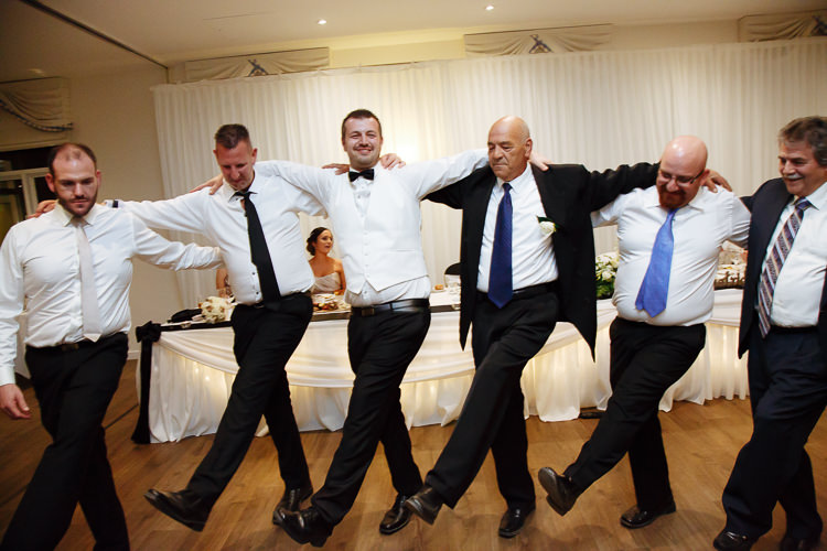 Alex and guests link shoulders for a Greek group dance at Lindenderry.