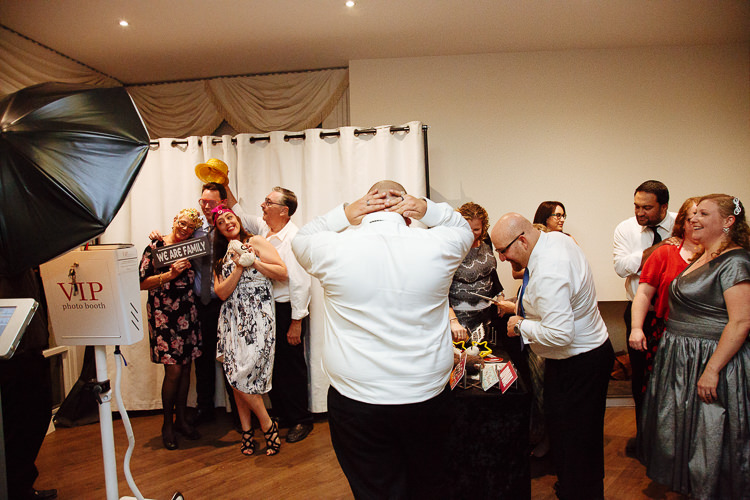 Guests pose with props at the photo booth at Lindenderry.